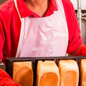 Handgards Valugard White Poly Apron - 100 per pack - 10 packs per case.